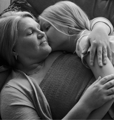 Child hugging a woman